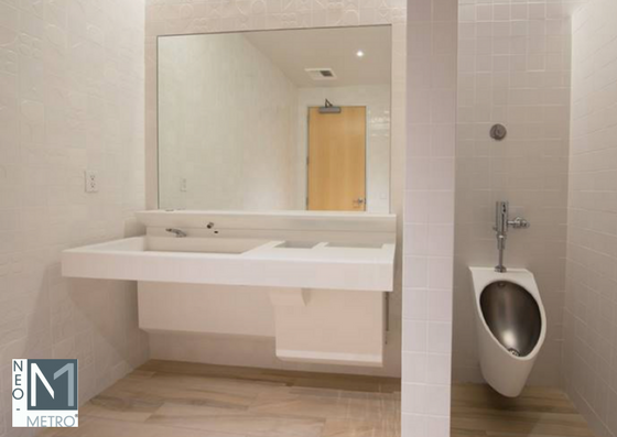 modern public restroom sink & trash unit closed solid surface sink console with access door closed